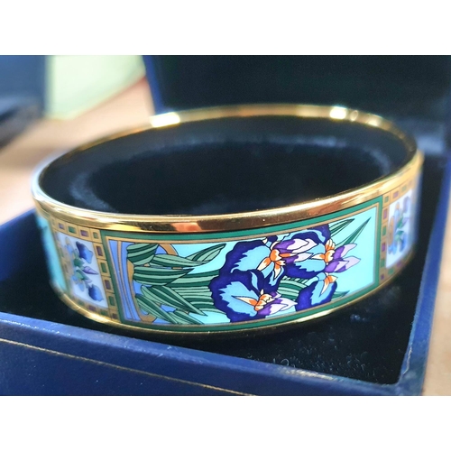 38 - Michaela Frey, Wien. A Viennese enamel bangle with Art Nouveau floral decoration complete with origi... 