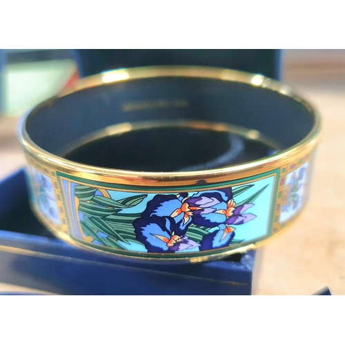 38 - Michaela Frey, Wien. A Viennese enamel bangle with Art Nouveau floral decoration complete with origi... 