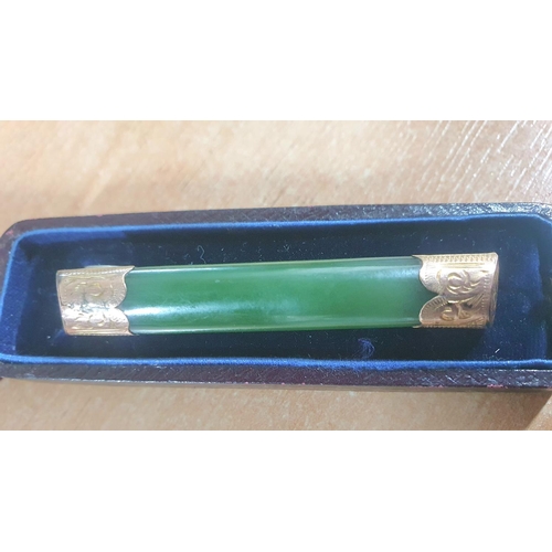 48 - Stunning Edwardian Jade bar brooch set in unmarked engraved yellow gold metal and in its original Sc... 