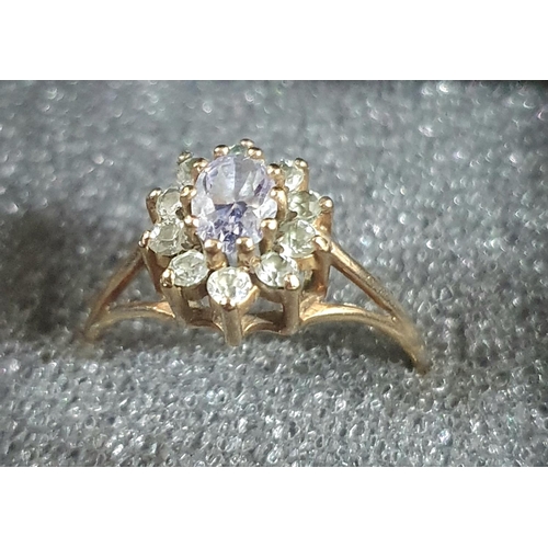 49 - Fine quality hallmarked 9ct yellow gold dress ring with an oval cut Amethyst standing above round cu... 