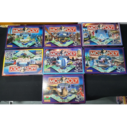 157 - Seven Monopoly board games with various UK city's and areas (7)