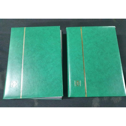 279 - Two matching green stamp albums containing thousands of GB QEII post 2000 stamps and sets (Thousands... 