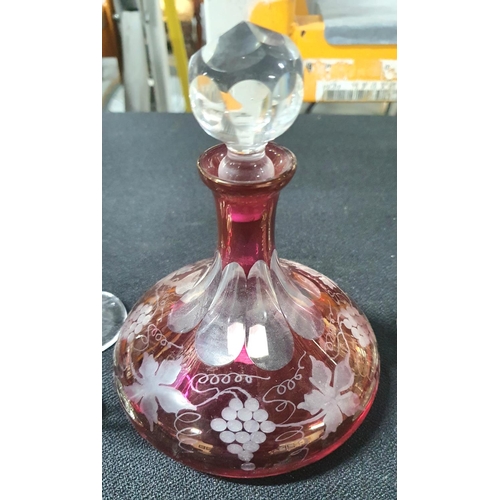 382 - Small Victorian cut-glass cranberry ships decanter with 4 matching cranberry glasses and 2 similar b... 