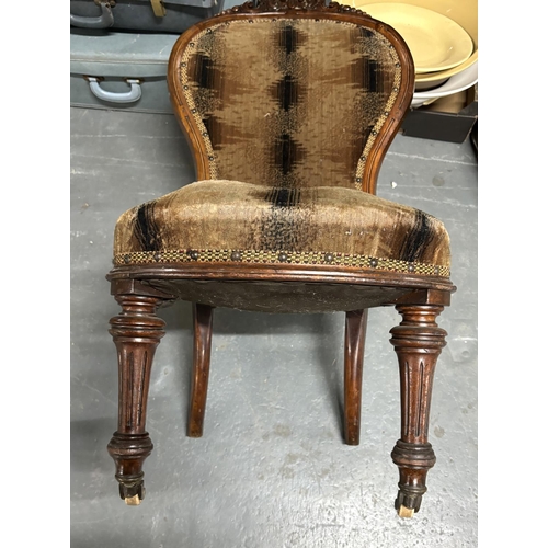 440 - Studded antique chair on casters