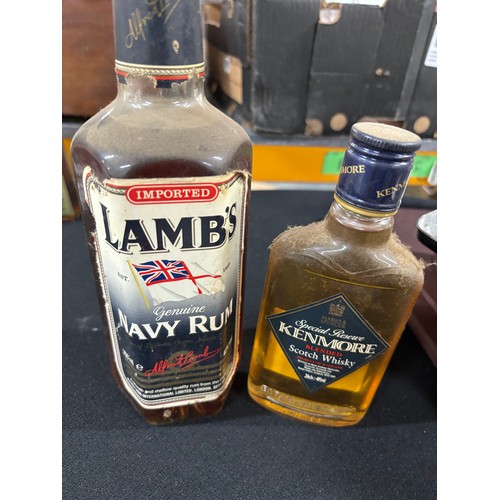 286 - 1 bottle of navy rum and 1 bottle of Kenmore whiskey