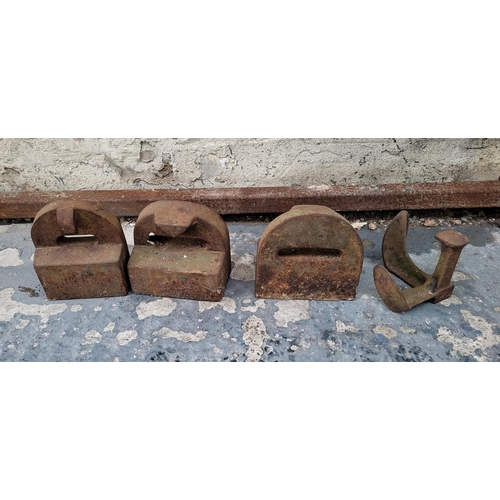 469 - Three cast iron blocks/door stops and a cast iron shoe last (4)