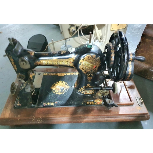 147 - 2 Sewing machines, 1 boxed Jones (hand) and 1 elcectric Singer (2)