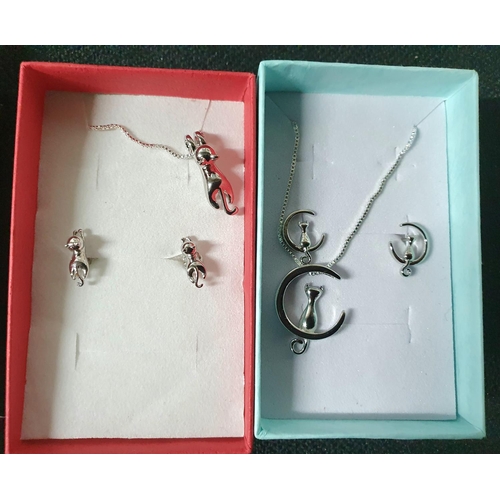 59 - Two silver chains and earrings, Cat themed (2)