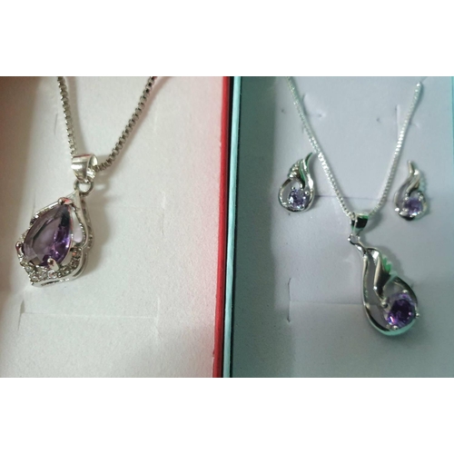 60 - Two  silver necklaces with Amethyst pendants, one with earrings, both in presentation boxes (2)