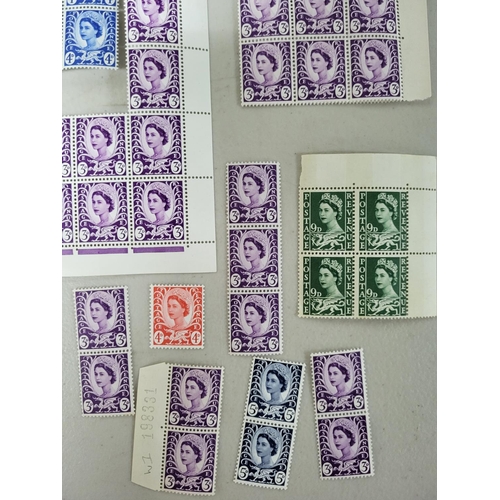 614 - Quantity of GB QEII regional definitives Wales, all mint unmounted blocks, etc, some with side bars ... 