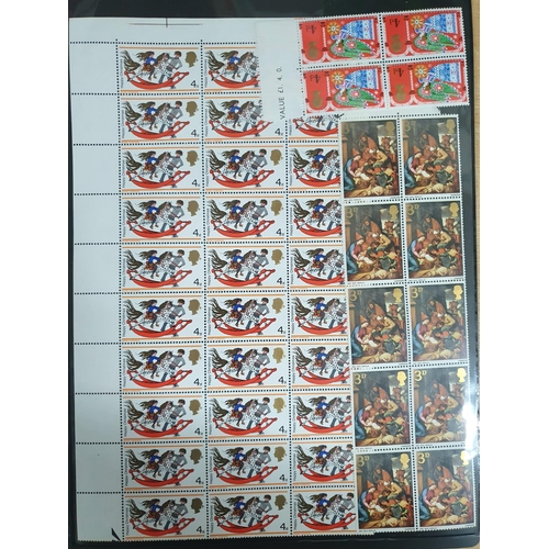 643 - Double sided sheet containing GB QEII pre-decimal Christmas stamps, all mint unmounted blocks, some ... 