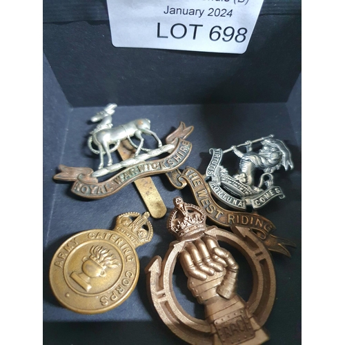 698 - Four old British army cap badges (4)