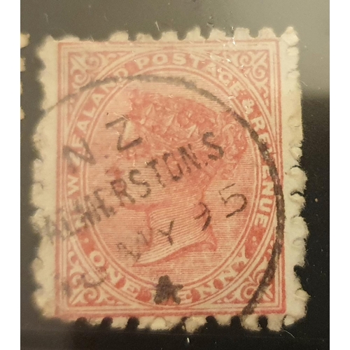 828 - New Zealand 1 cent stamp 1893, used unmounted with fine cancelation in clear plastic display case.

... 