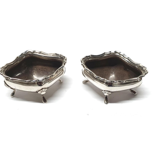 16 - Pair of large Birmingham 1915 silver salts, both standing on 4 feet,

106.5 grams