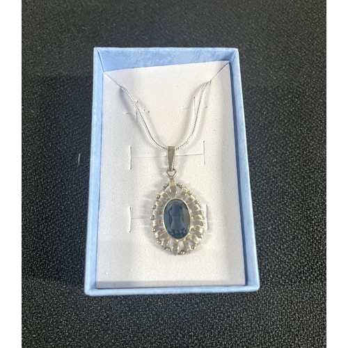 33 - Blue stone pendant on silver chain along with large multi gemstone on silver chain (2)