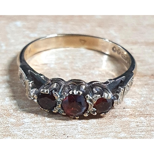 49 - 9ct yellow gold hallmarked ring inset with 3 Garnets,

2.3 grams                    size M