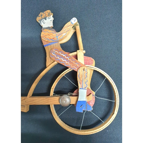 76 - Unicycle wooden painted puch toy