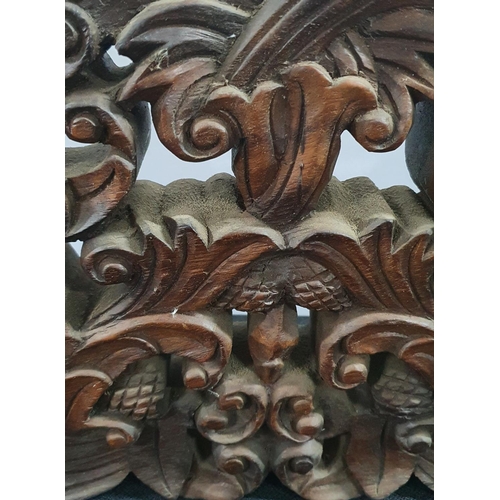 139 - Finely carved hardwood panel,

26 x 51cm