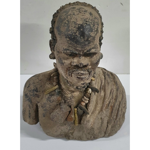 150 - Unusual, unsigned 20thC clay model of an African man,

23cm tall