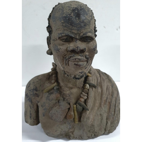 150 - Unusual, unsigned 20thC clay model of an African man,

23cm tall