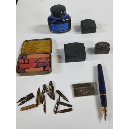 163 - Collection of stationary related materials including a collection of pen nibs, Parker ink, stamps et... 