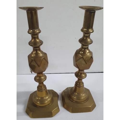 174 - Two pairs of antique brass candle-sticks