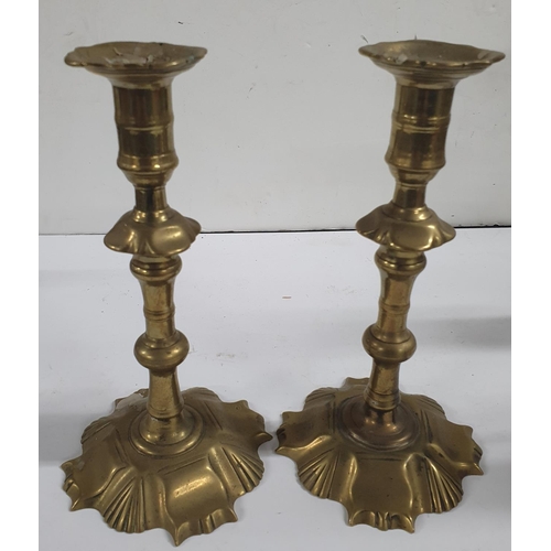 174 - Two pairs of antique brass candle-sticks