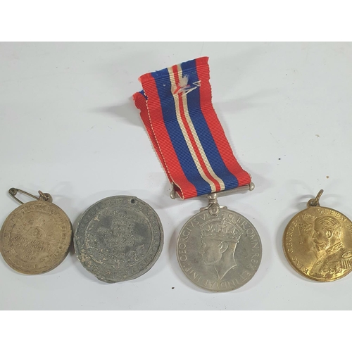 175 - Collection of WWII era militaria medals, cap badges etc (Qty).