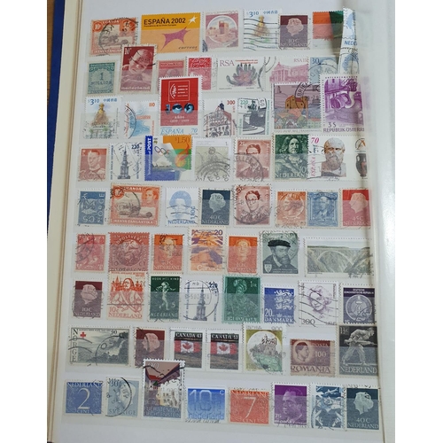 210 - Blue stock book containing a large quantity of world stamps, mainly used (HUndreds)