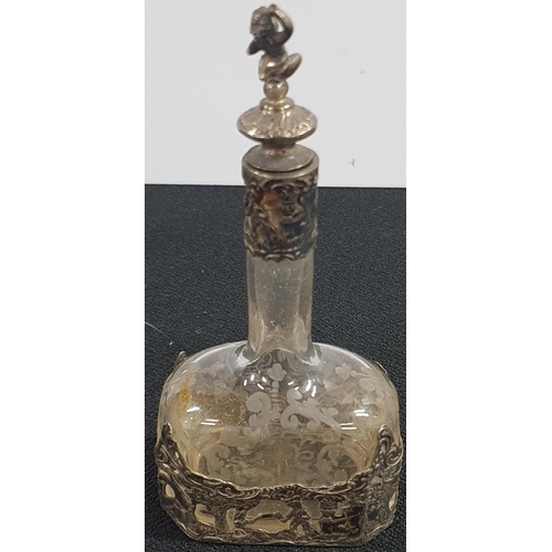 254 - Victorian scent bottle with etched glass decoration and silver fretwork decoration