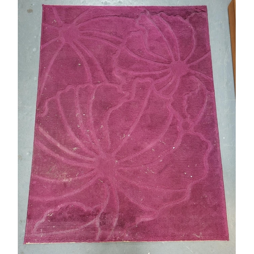 257 - Purple rug with floral patterns measures 155cm x 118cm