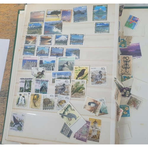 855 - Green stock book containing a large collection of New Zealand 20thC used stamps together with NZ 198... 