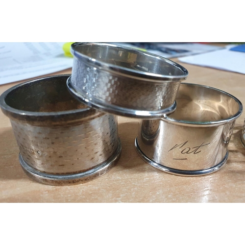 38 - Collection of hallmarked English silver to include 3 napkin rings, a coffee cup holder and thimble a... 