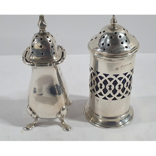 46 - Two British hallmarked silver pepper pots, one with blue glass liner (2),

Total silver weight - 42 ... 