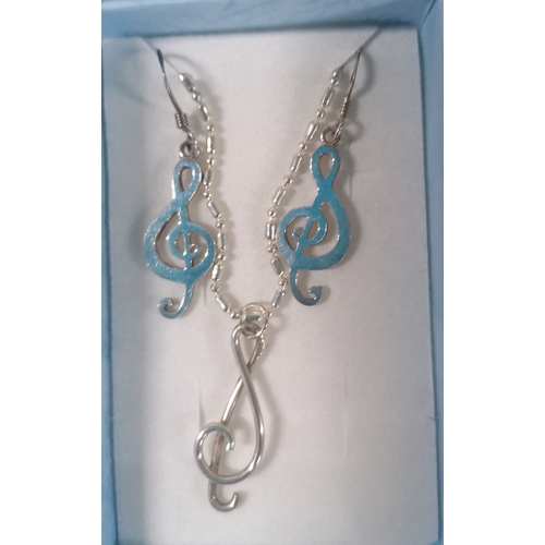 57 - 925 silver treble clef  pendant on chain with earrings and a silver gilt MOP pendant on a chain with... 