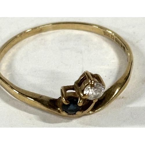 65 - 9ct yellow gold blue and white stone dress ring