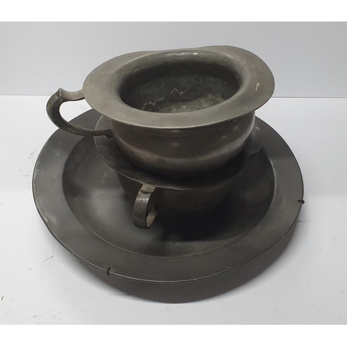 120 - Two antique pewter chamber pots together with a large antique Pewter charger (3)