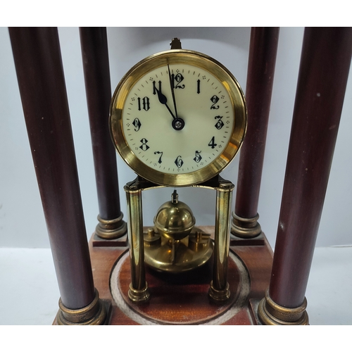 130 - Gustav Becker largem domed clock and pendulum in wood cased surround, with key