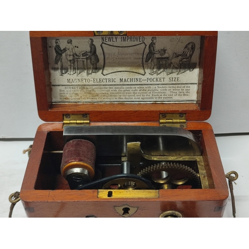 133 - Franks Manufacturing, antique pocket sized Magneto Electric machine presented in wooden box with all... 