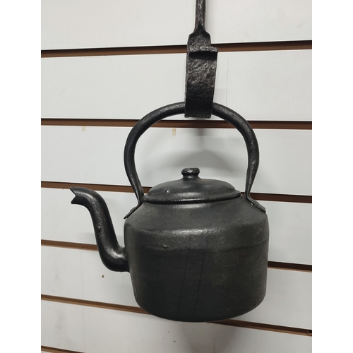 155 - Iron four pint kettle with it's hanger