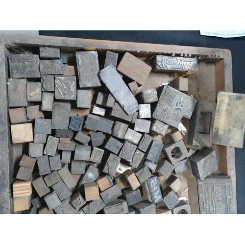 235 - Wooden printers tray containing a large quantity of small old printing blocks (Qty)