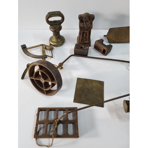 321 - Collection of various weights and weighing tools and two brass 