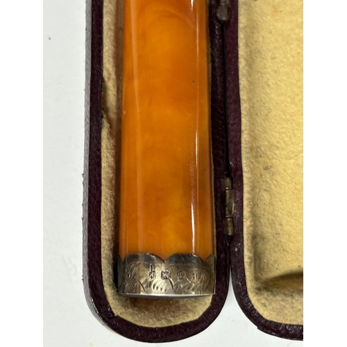 339 - Victorian cased Amber cheroot holder with Silver tip