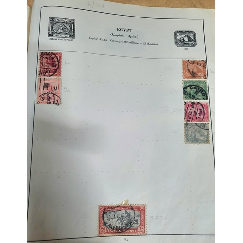 574 - Old red Strand stamp album with a quantity of 19th and 20thC world stamps (Qty)