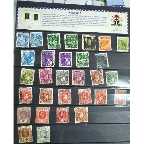 581 - Red Kabe Album containing a large quanity oif mint and used 20thC world stamps, A-V (Hundreds)