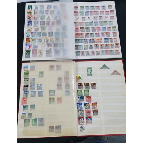 586 - Two albums, green and red, the red containing used 20thC New Zealand stamps the green, Mainly 20thC ... 