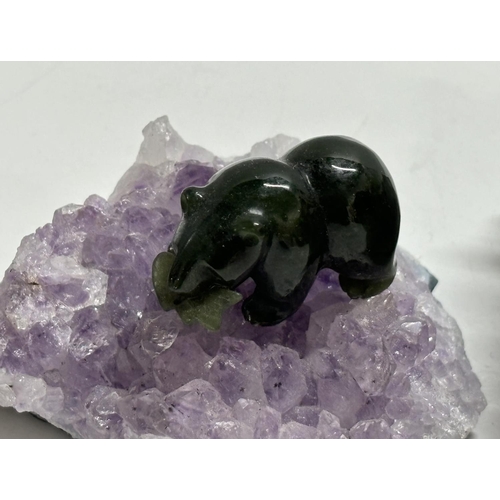 391 - Three amethyst crystal specimens 1 with a Jade polar bear (3)