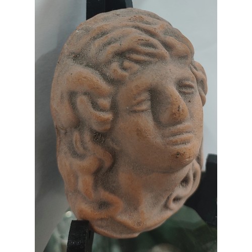 388 - Small old terracotta hanging plaque of a woman's face