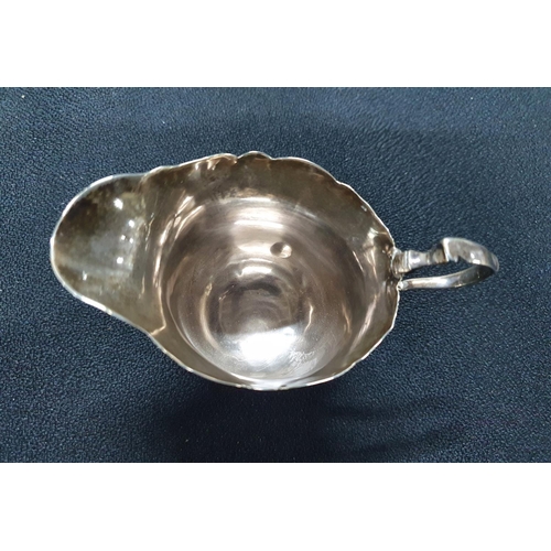 23 - London 1909 silver 3-footed milk jug,

62 grams