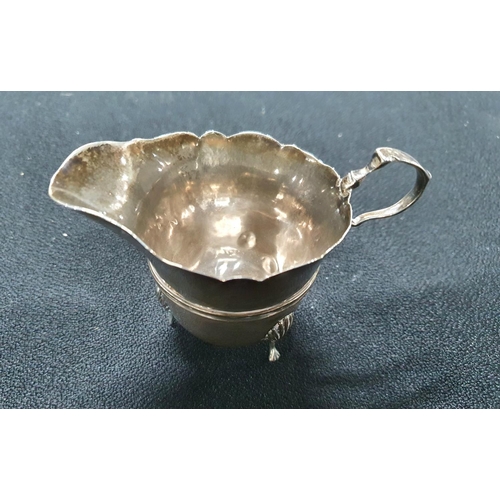 23 - London 1909 silver 3-footed milk jug,

62 grams